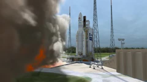Wide shot of the Ariane 5 launching with heavy smoke and fire