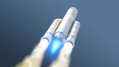 Low-angle tracking shot of the Ariane 5 flying upwards with bright exhaust plumes