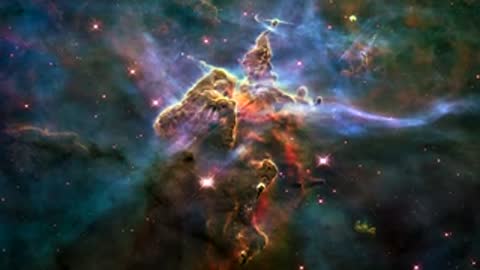 Animation of Carina Nebula with glowing stars and gas clouds.