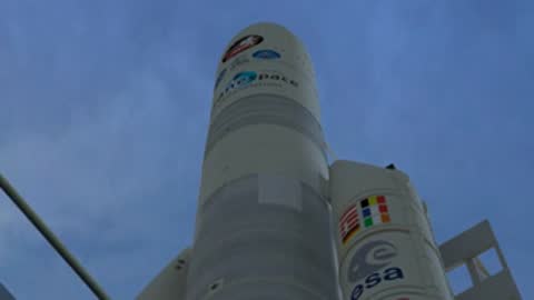 Medium shot pointing up the Ariane 5 rocket body with 'Arianespace' logo