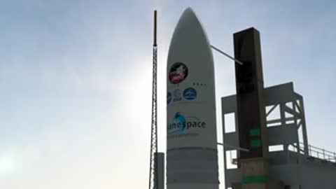 Medium shot of the Ariane 5 nose cone with Arianespace logo against the sky