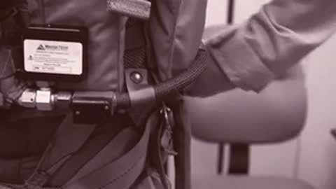Close-up of breathing monitoring equipment attached to a flight harness.