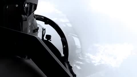 View from inside a cockpit looking forward over a cloudy or bright landscape.