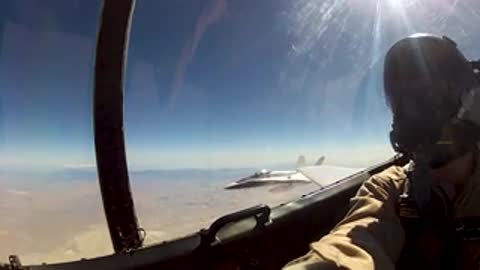 View from cockpit of another aircraft in flight.
