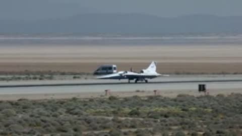 X-59 aircraft taxiing down runway at airfield.