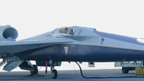X-59 aircraft parked on tarmac with open cockpit and ground crew.