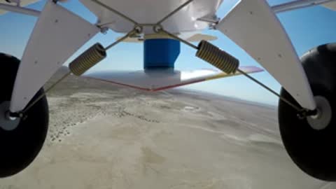 Aerial and ground views of a small red and white airplane flying