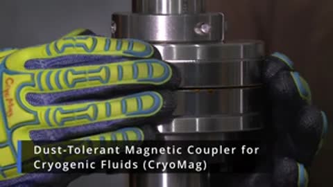 Close-up of hands in gloves interacting with metal components labeled CryoMag
