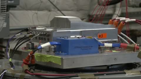 Close-up of electronic hardware components being tested on a rig