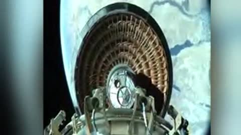 Camera view from inside a spacecraft looking back at an deployed heat shield structure