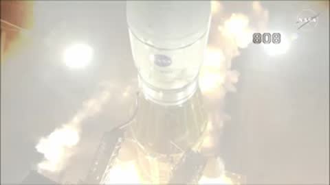 Close-up view of a rocket launch with heavy smoke and engine ignition.