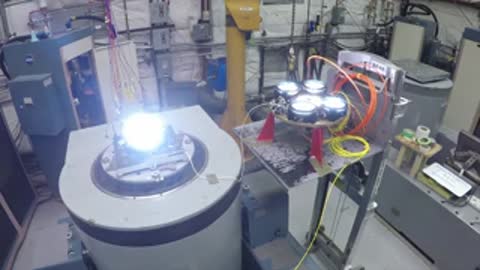 Laboratory equipment undergoing a bright light intensity test indoors.
