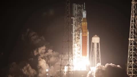 Nighttime launch of a rocket from the launchpad with bright illumination.