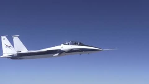 White and blue jet aircraft flying smoothly in clear blue skies.