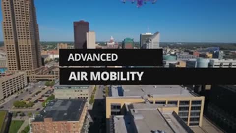 Researcher outdoors next to equipment cases with a city skyline shown via augmented reality.