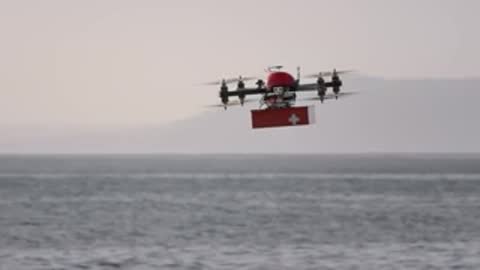 Space view transitioned to a quadcopter drone flying over water