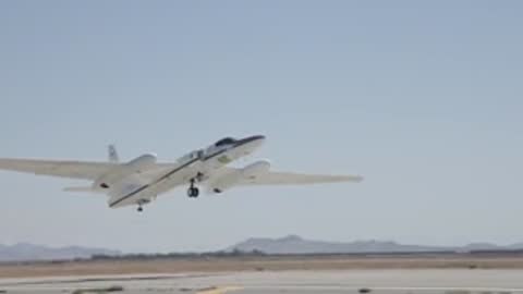 A high-altitude reconnaissance aircraft takes off from a runway.