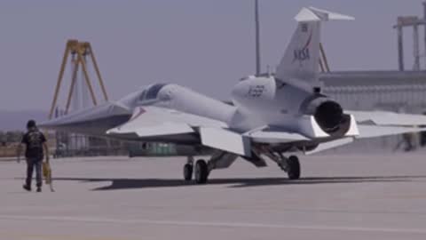 Rear three-quarter view of the NASA X-59 aircraft on the tarmac.