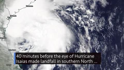 Satellite imagery of Hurricane Isaias approaching coastline, weather data.