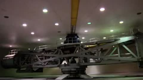 Large rotating mechanical test rig in a brightly lit industrial testing room