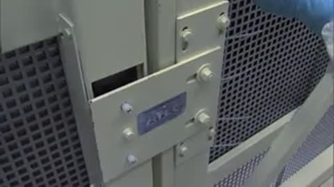 Closing of a protective mesh door or enclosure panel in a lab