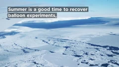 Aerial view of snow-covered landscape in Antarctica during summer.