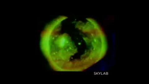 Skylab footage of the Sun in green filter showing coronal loops