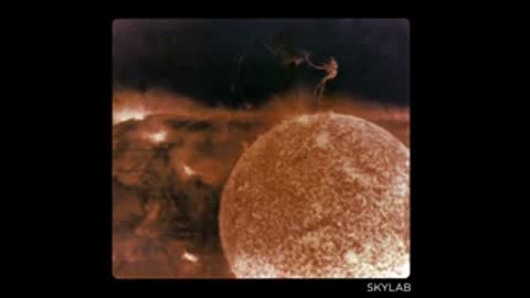 Skylab footage of the Sun's surface and prominences in orange filter