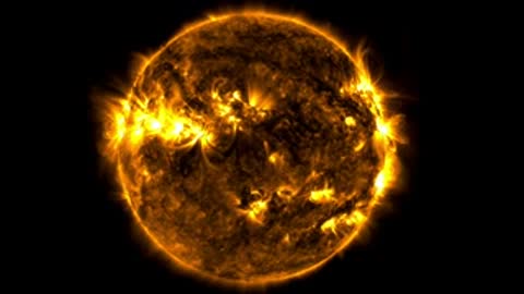 Close-up view of the active Sun in golden ultraviolet light showing solar flares