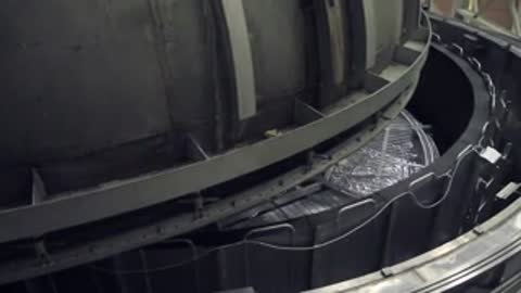 Interior view of the large cylindrical testing facility with mechanical structures