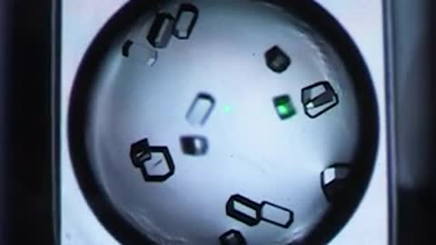 Microscopic view of crystal structures in a liquid solution