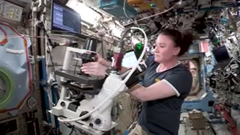 Astronaut working at station inside ISS.