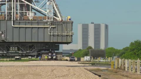 Medium shot of the mobile launcher base approaching the camera path.