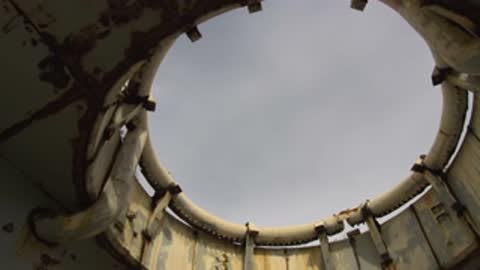 Slowly tracking circular frame focusing on the open sky above