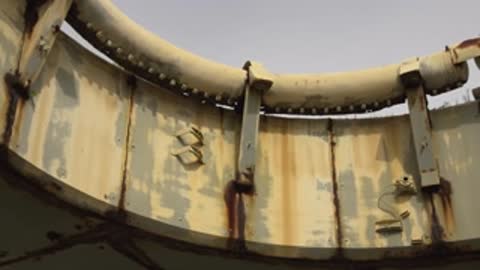 Close-up view of structural metal rim showing numbers painted on panels