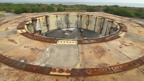 High angle shot of the top opening of a concrete structure.