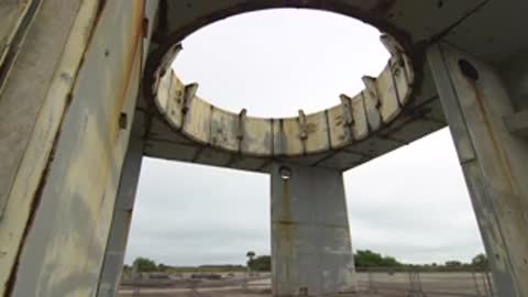 Low angle shot of the interior of a concrete structure looking up.
