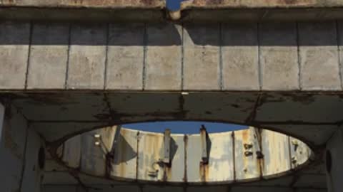 Close-up of the upper beam and opening of a concrete structure.