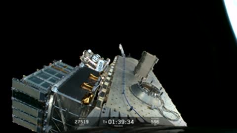 Satellite structure drifting in the dark expanse of space.