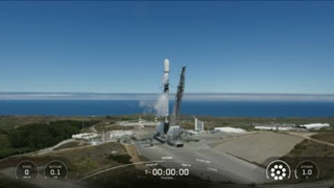 Rocket lifts off from the launch pad, smoke and fire billowing.