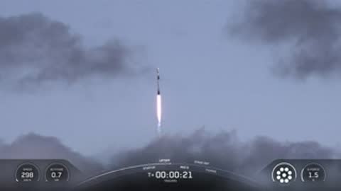 Rocket climbs through the sky, trailing a flame.