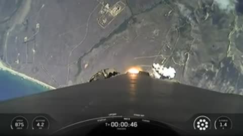 Aerial view from the rocket showing the ground receding below.