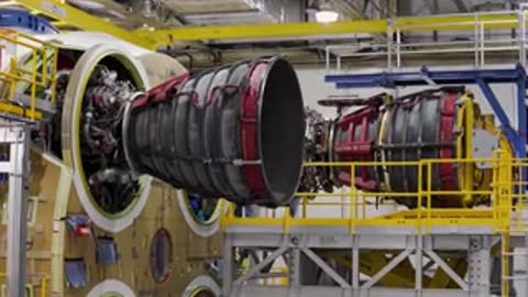 Medium shot of multiple rocket engines mounted in an industrial framework.