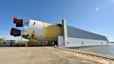 Rocket stage positioned inside transport barge dock structure