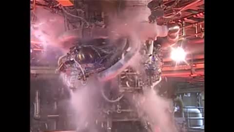 Engine testing with white steam puffs in a facility.