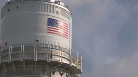 close up of american flag on transported rocket section exterior
