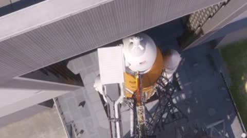 high angle shot of fully assembled rocket inside structure