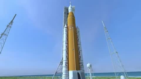 medium shot panning up side of rocket on launch pad structure