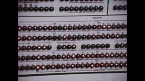 close-up of electronic panel with glowing red indicator lights