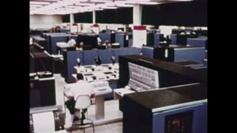 overhead view of mission control center room with desks